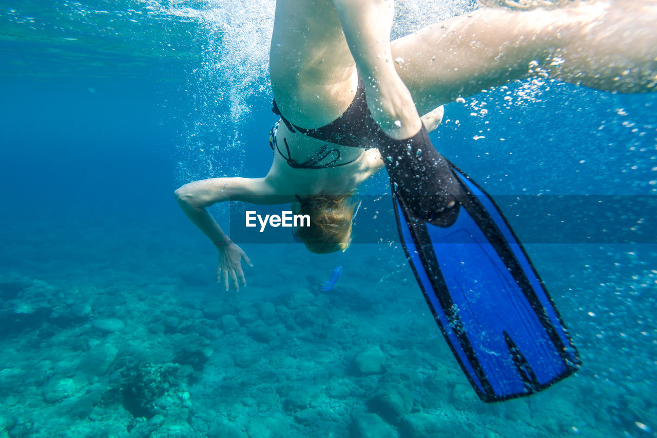 Woman swimming in sea