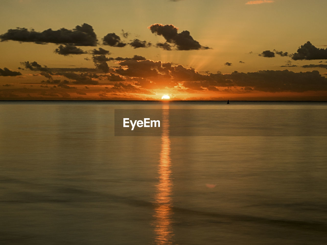 SCENIC VIEW OF SEA AGAINST ORANGE SKY DURING SUNSET