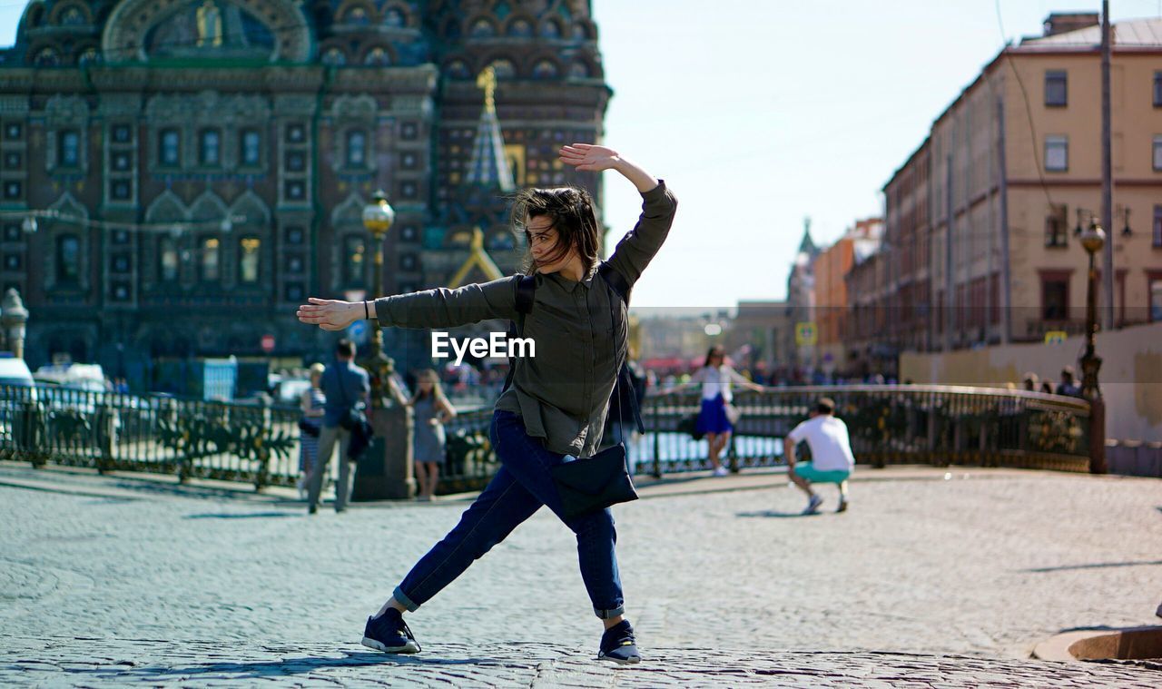 Woman standing in city