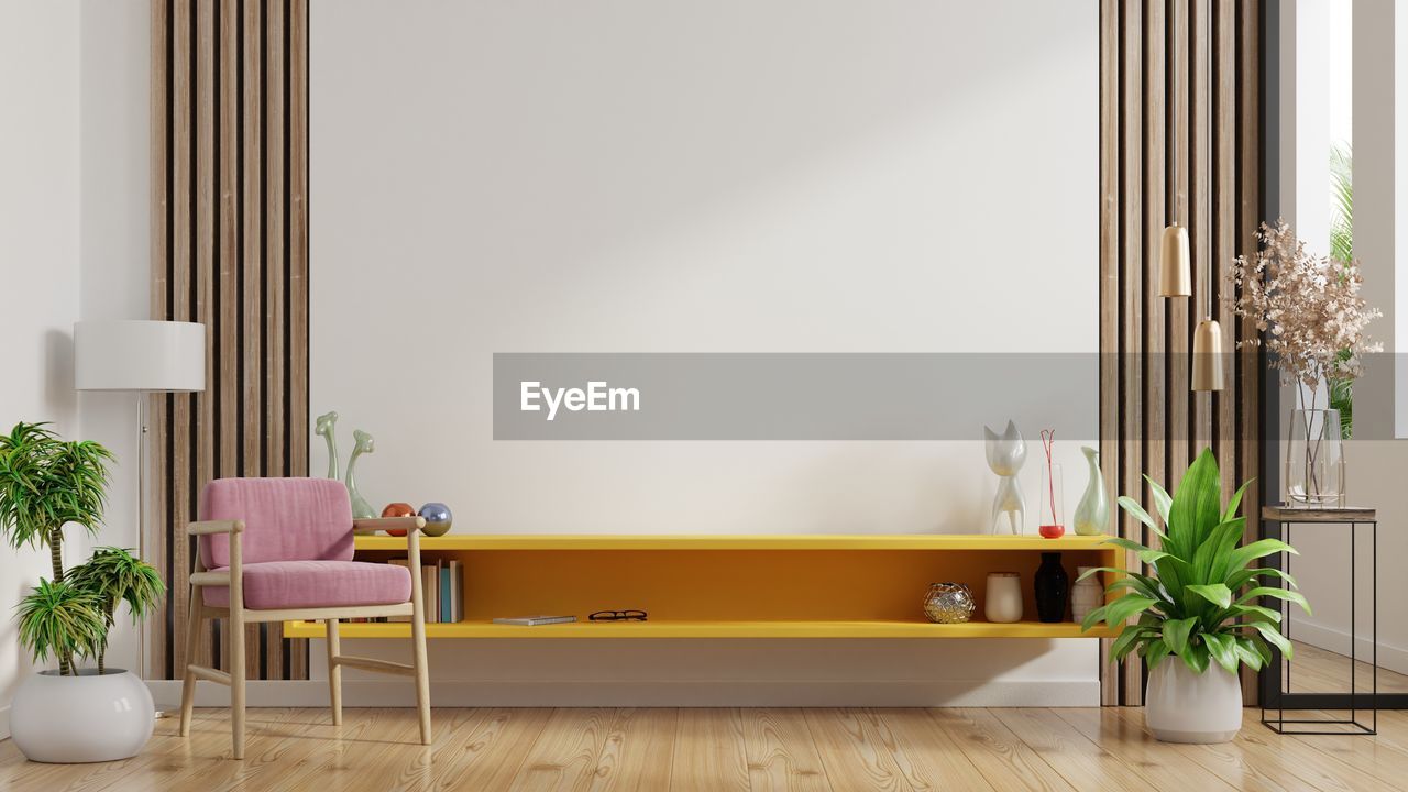 Shelf for tv in modern living room with pink armchair have empty white wall background.3d rendering