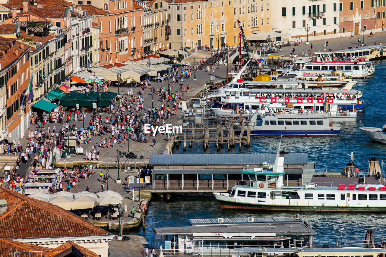 HIGH ANGLE VIEW OF BOATS IN CANAL