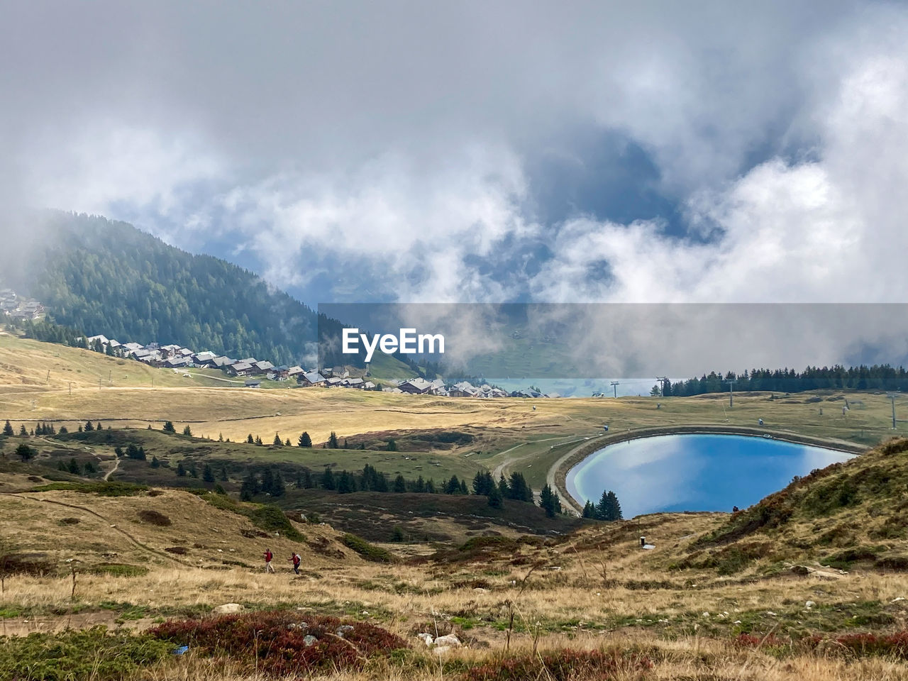 View in a cloudy atmosphere to a lake near bettmeralp, switzerland