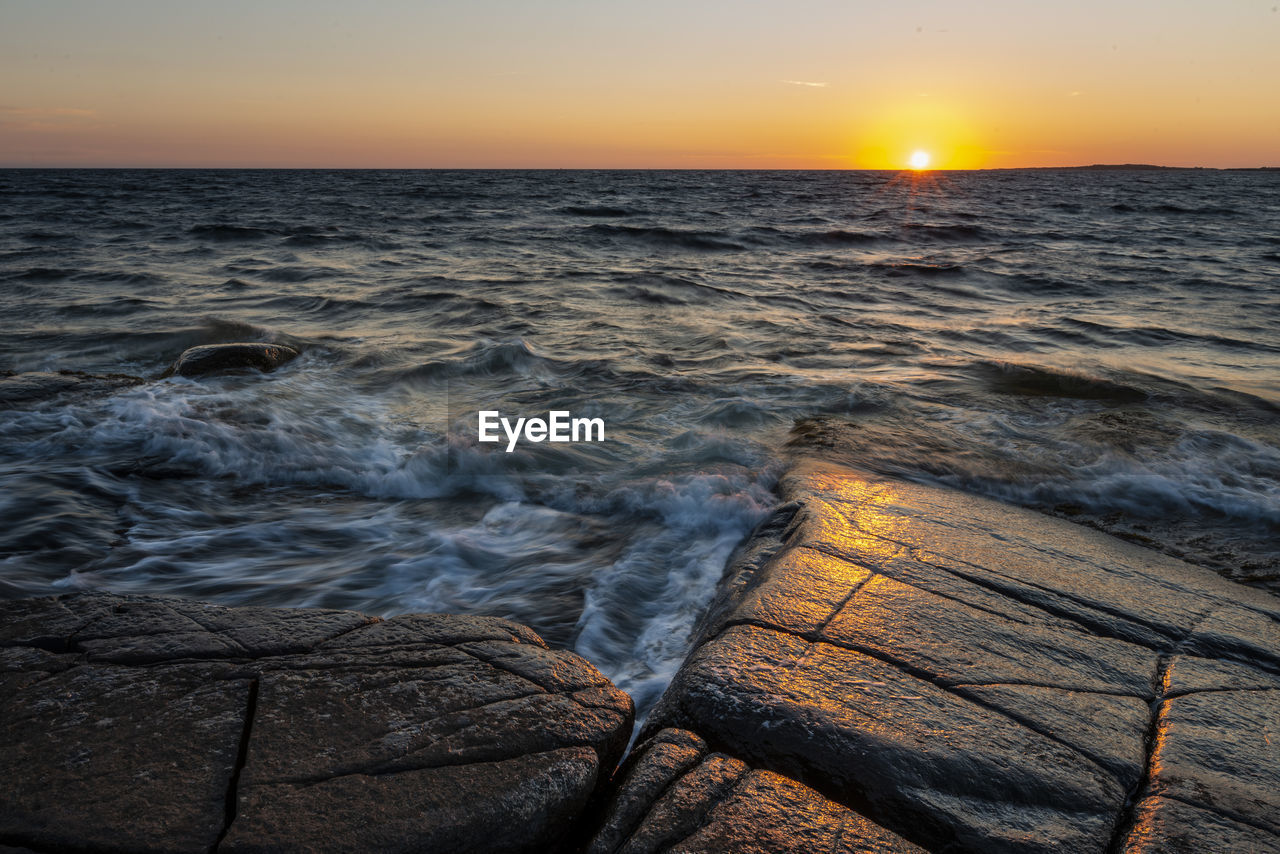 Scenic view of sea against sky during sunset