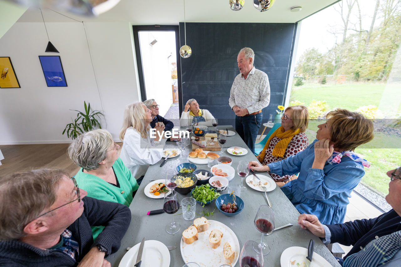 high angle view of family having food at table at home