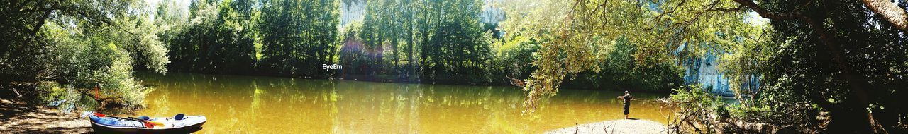 Panoramic boat in calm lake