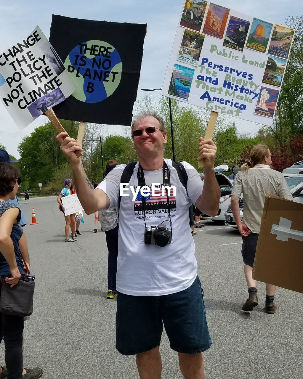 PEOPLE ON STREET WITH TEXT ON THE BACKGROUND