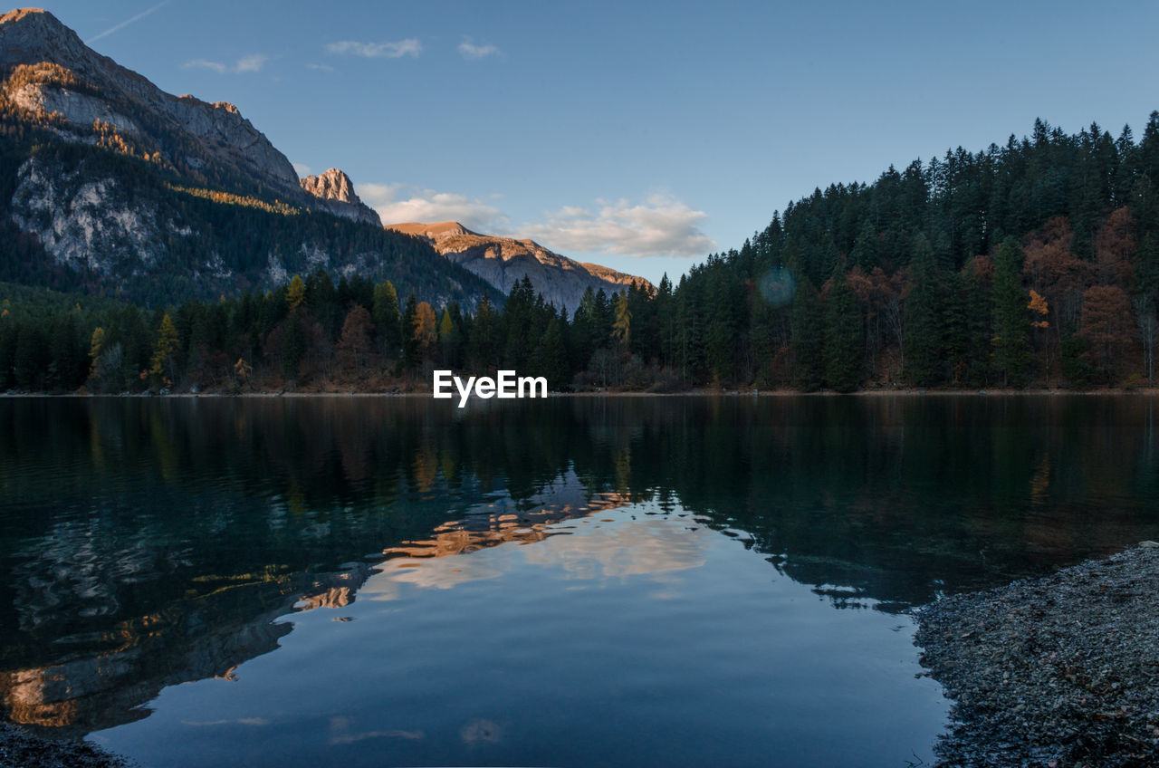 Scenic view of lake and mountains against sky