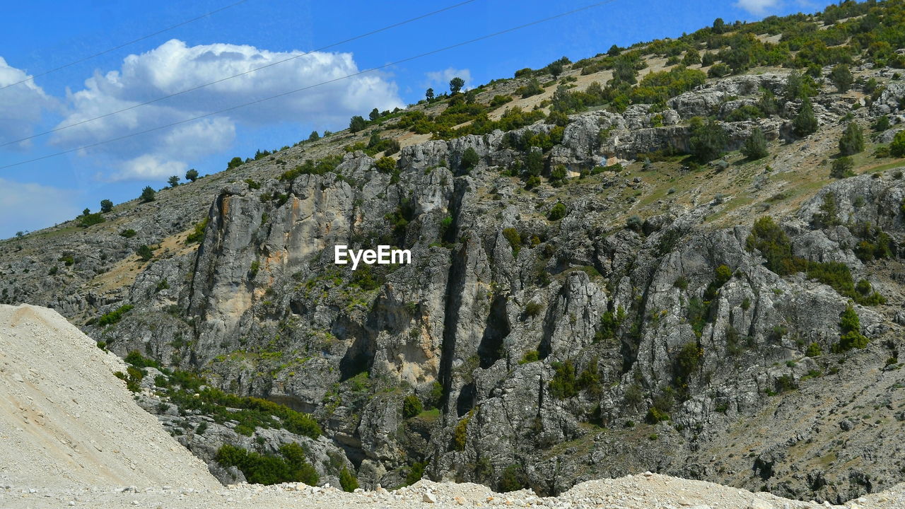 Scenic view of rocky mountains against sky