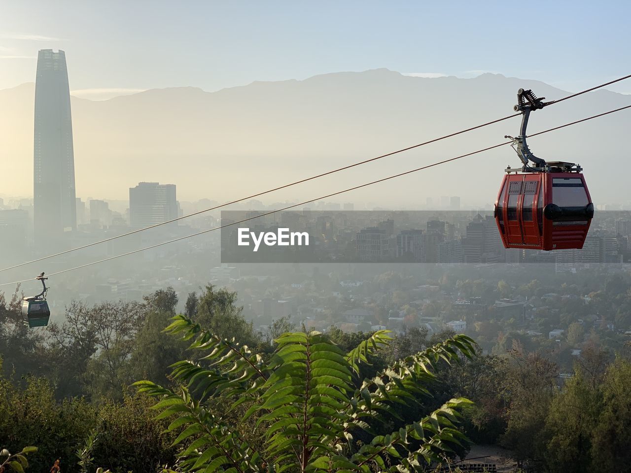 Overhead cable car over santiago chile cityscape against sky