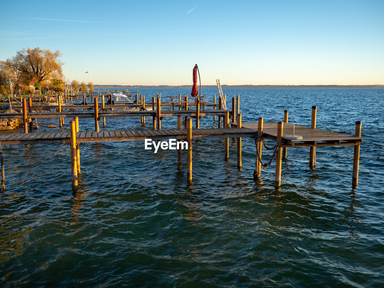 Pier on sea against clear sky