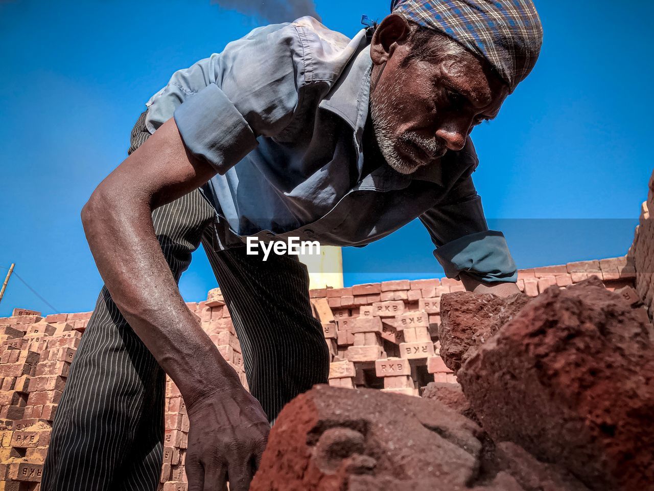 Low angle view of man standing against built structure