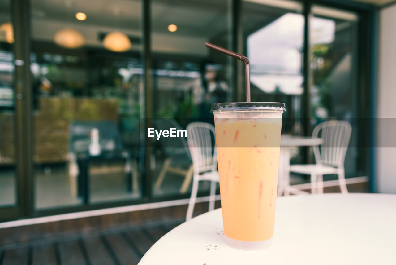 CLOSE-UP OF DRINK ON TABLE AT RESTAURANT