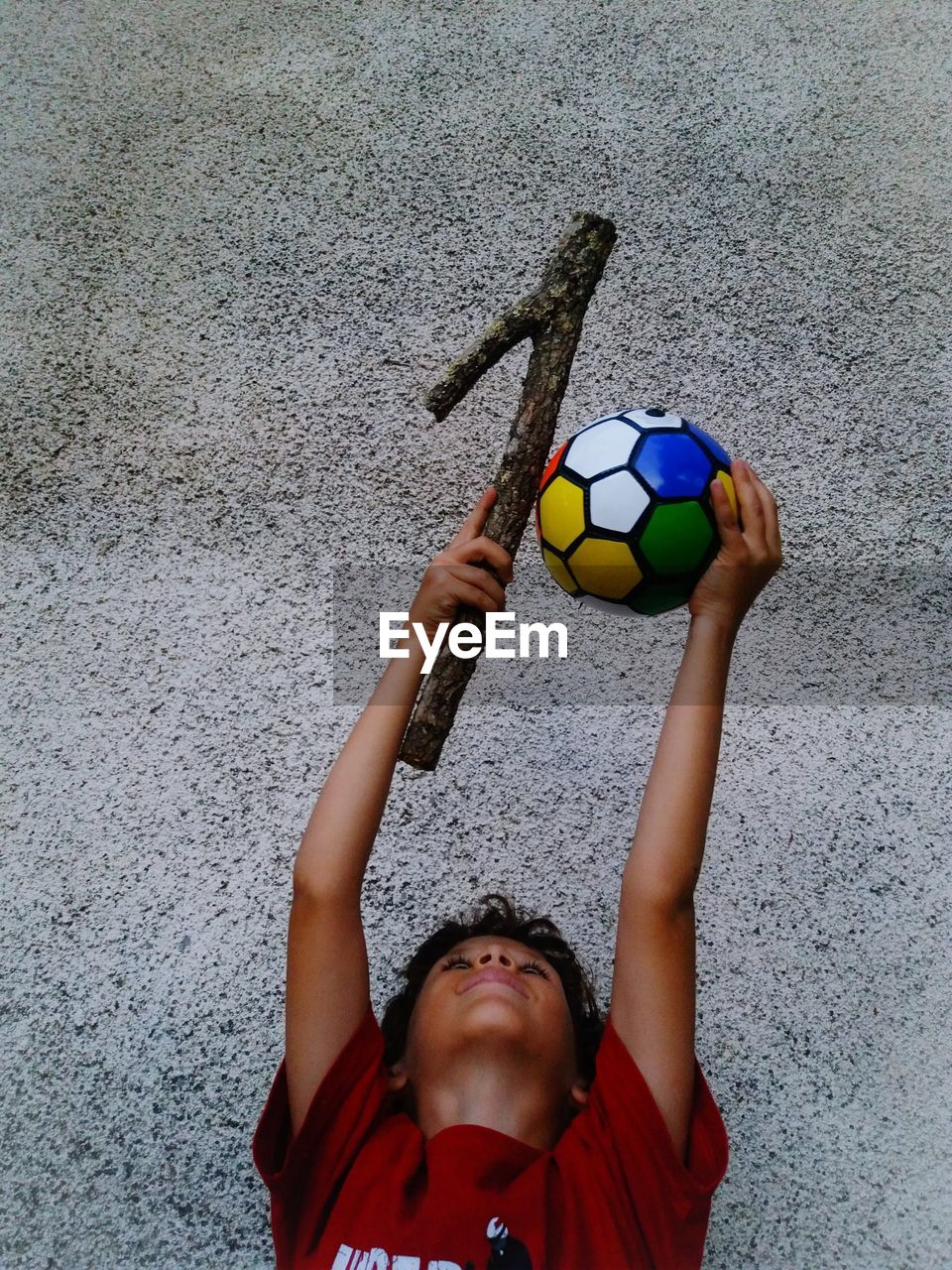 PORTRAIT OF BOY PLAYING WITH BALL