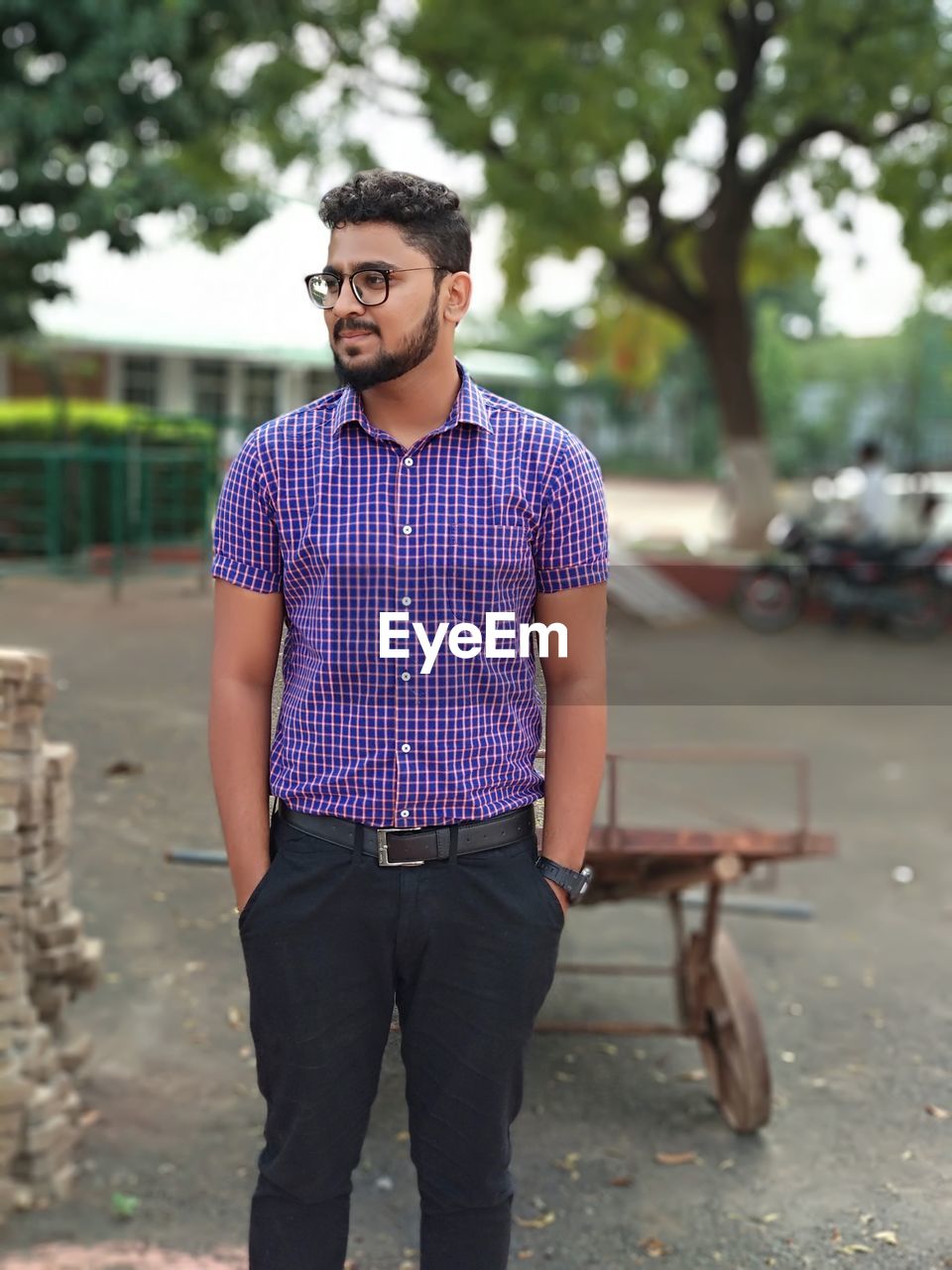 Young man standing on road