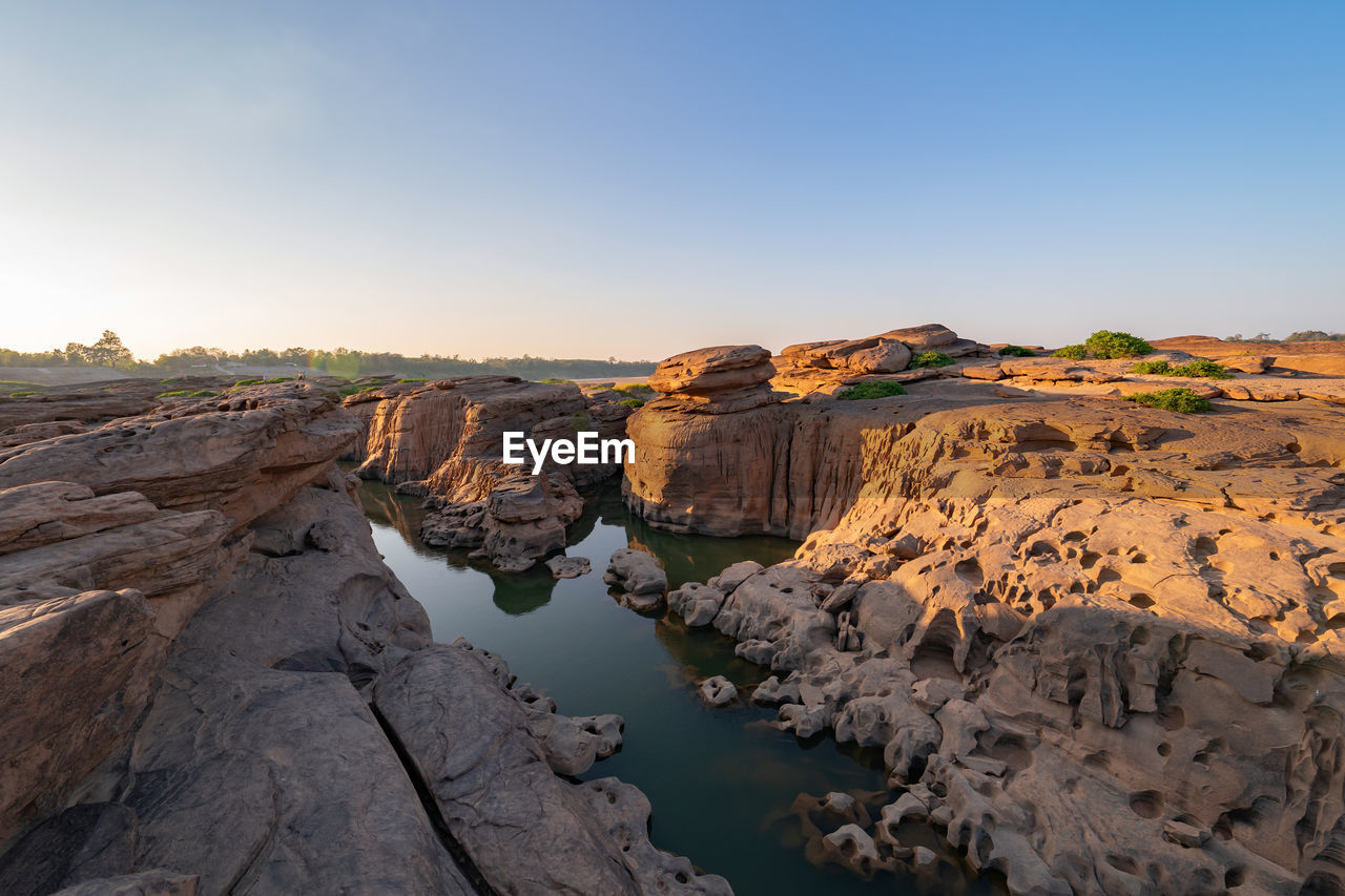 ROCK FORMATIONS ON LAND AGAINST SKY