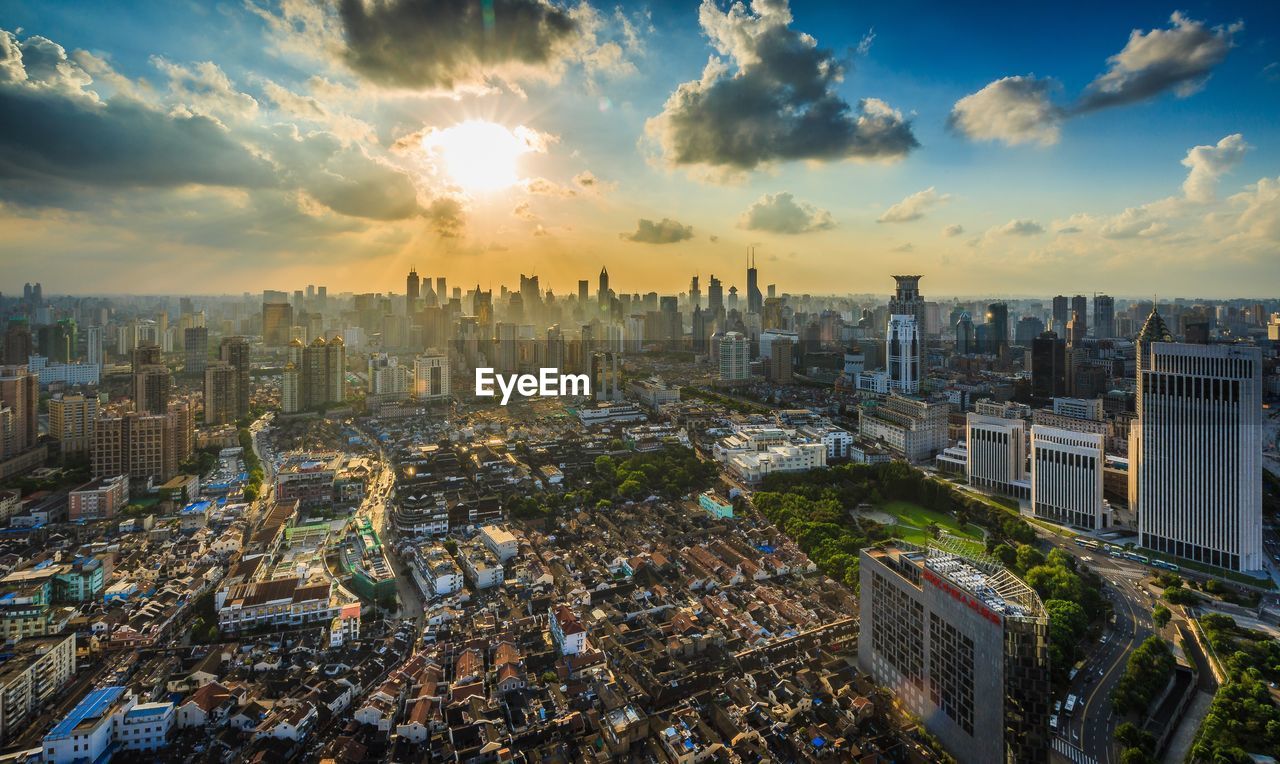 Cityscape against sky during sunset