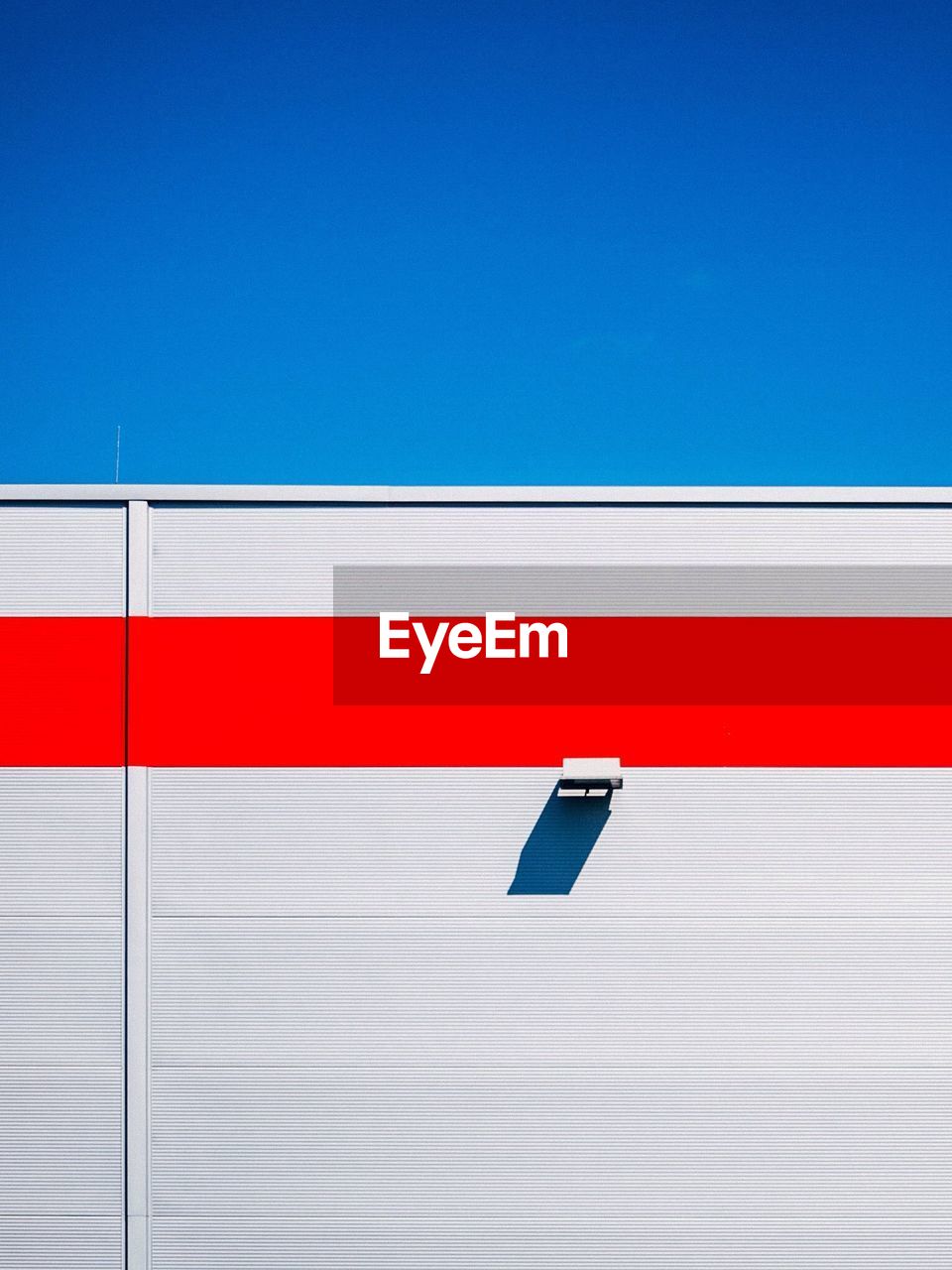 Detail shot of wall against clear blue sky