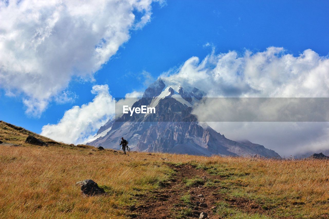 SCENIC VIEW OF MOUNTAIN AGAINST SKY