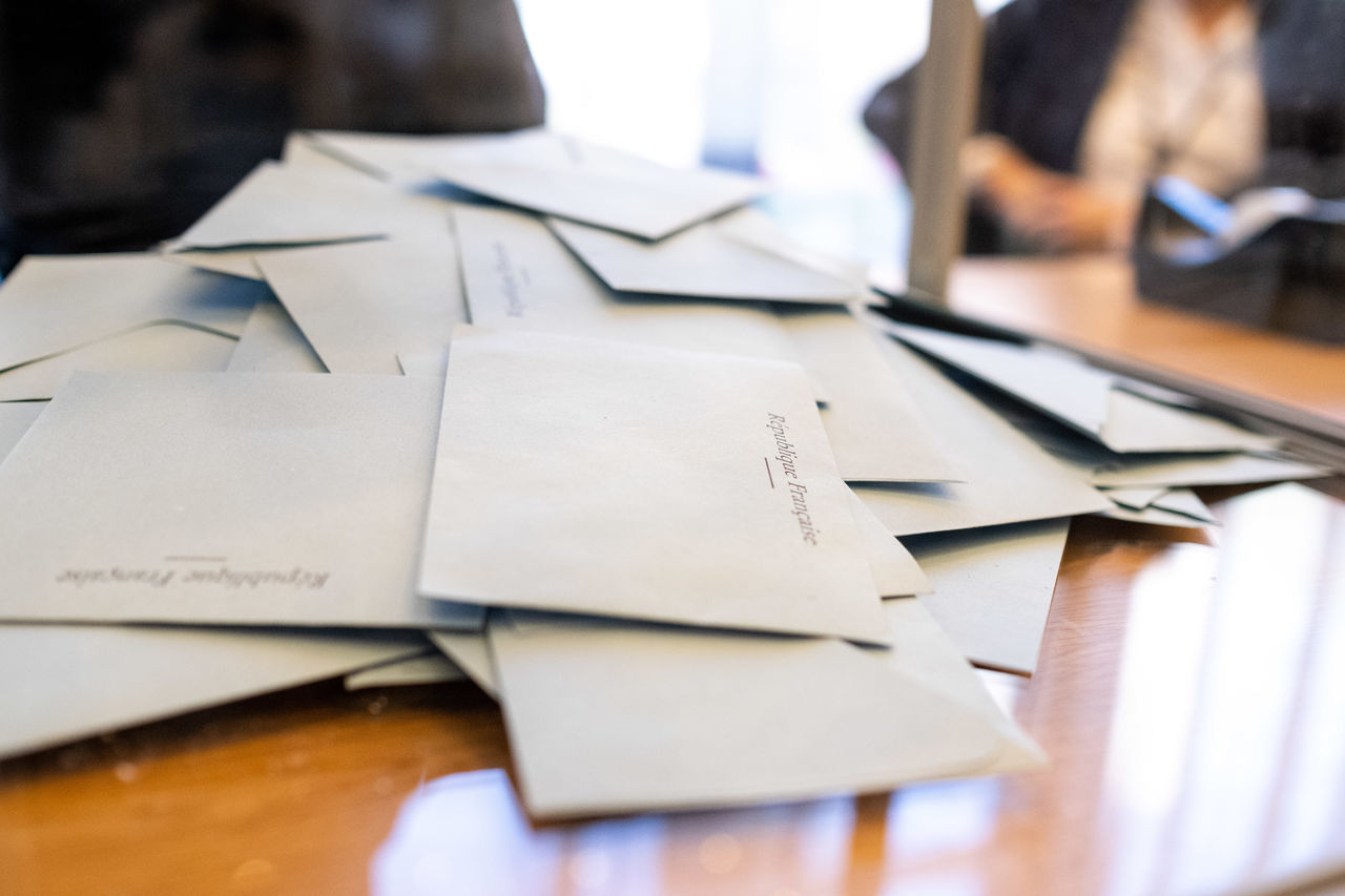 close-up of business colleagues working on table in office