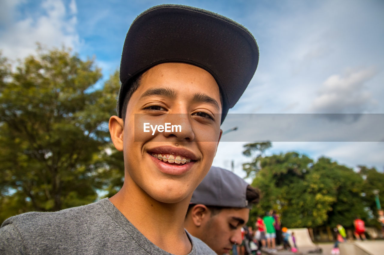 Close-up portrait of smiling teenage boy