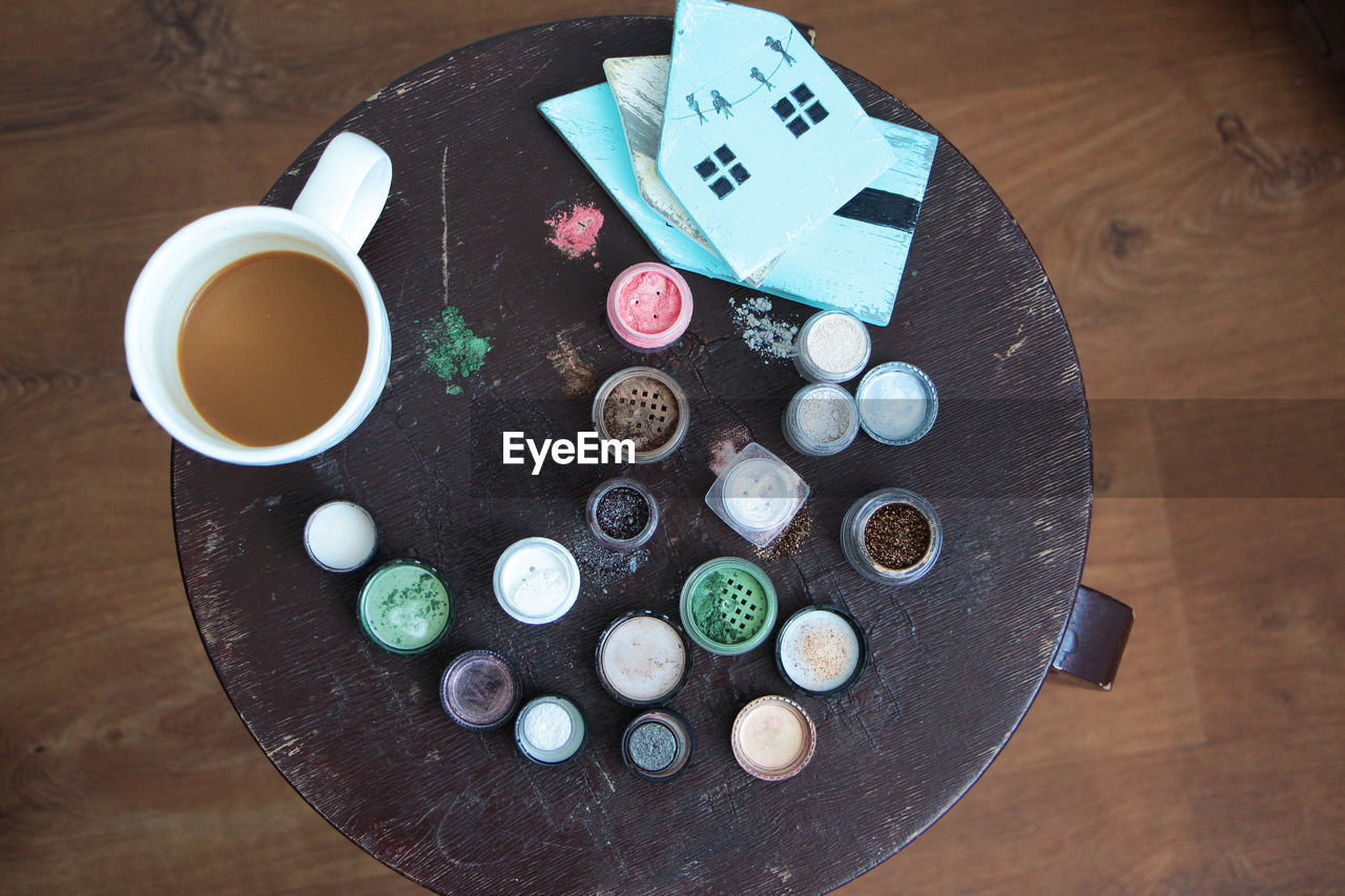 High angle view of containers on wooden table