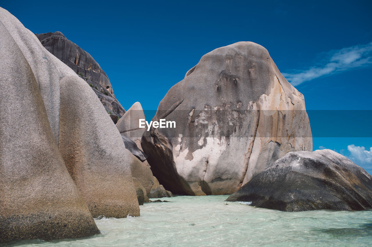 Rock formations against blue sky