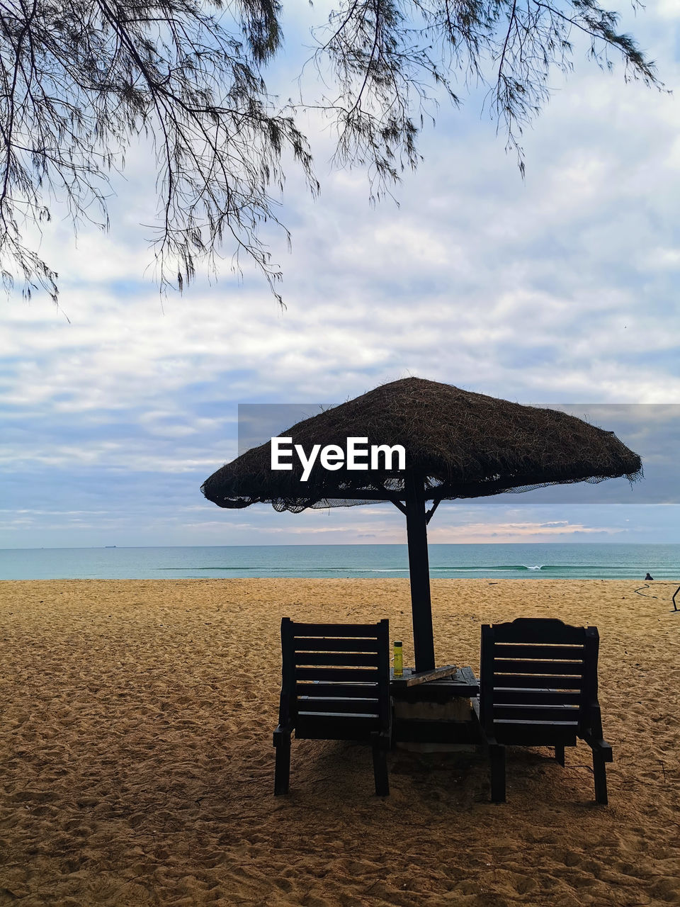 CHAIR ON BEACH AGAINST SEA