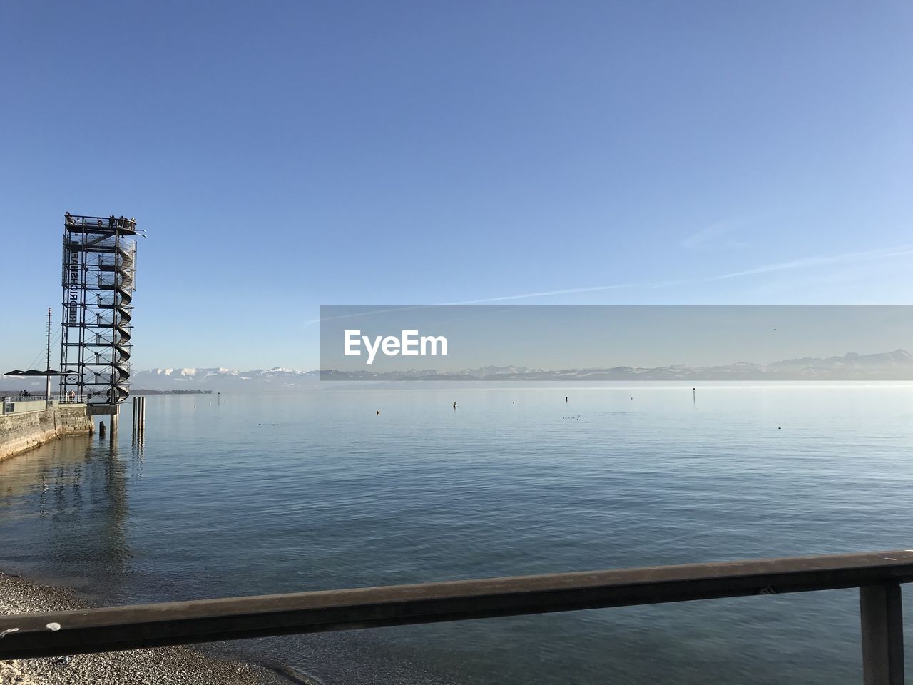 Scenic view of bay against clear sky