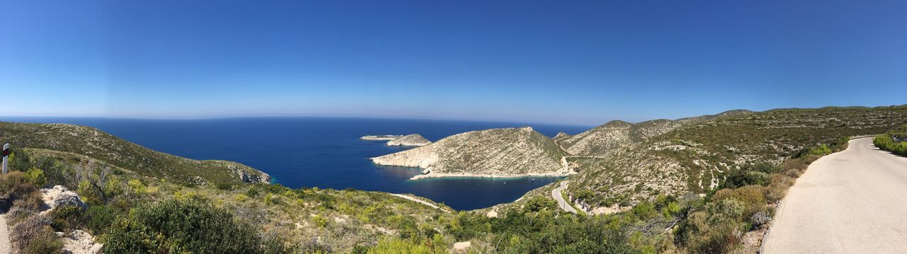 Scenic view of sea against clear blue sky