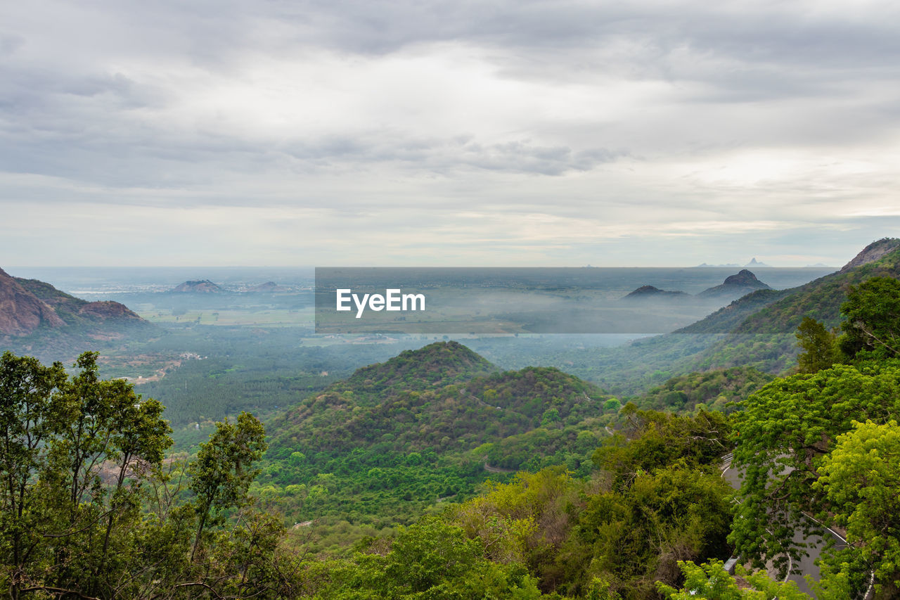 Scenic view of landscape and mountains against sky