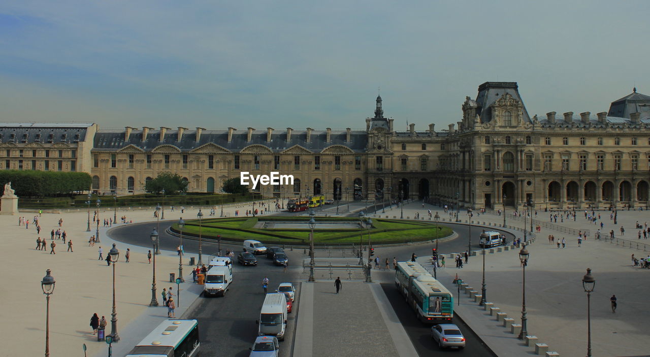 Louvre palace against sky in city