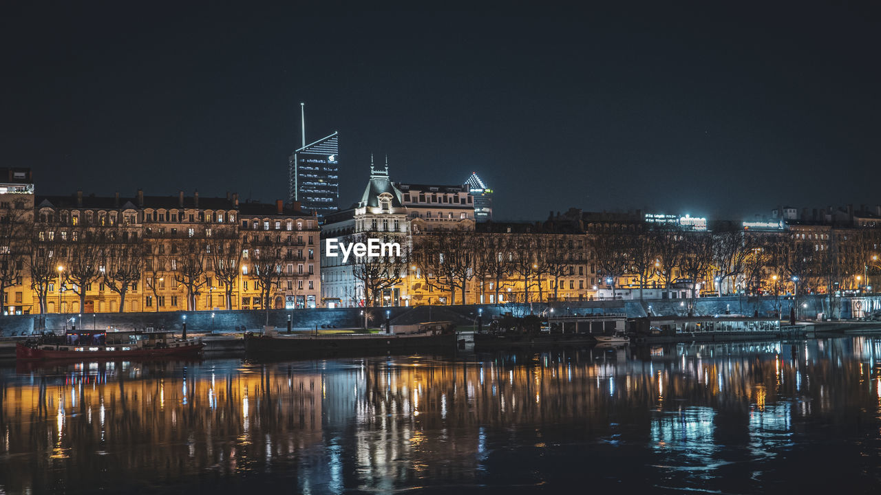 Reflection of illuminated buildings in river