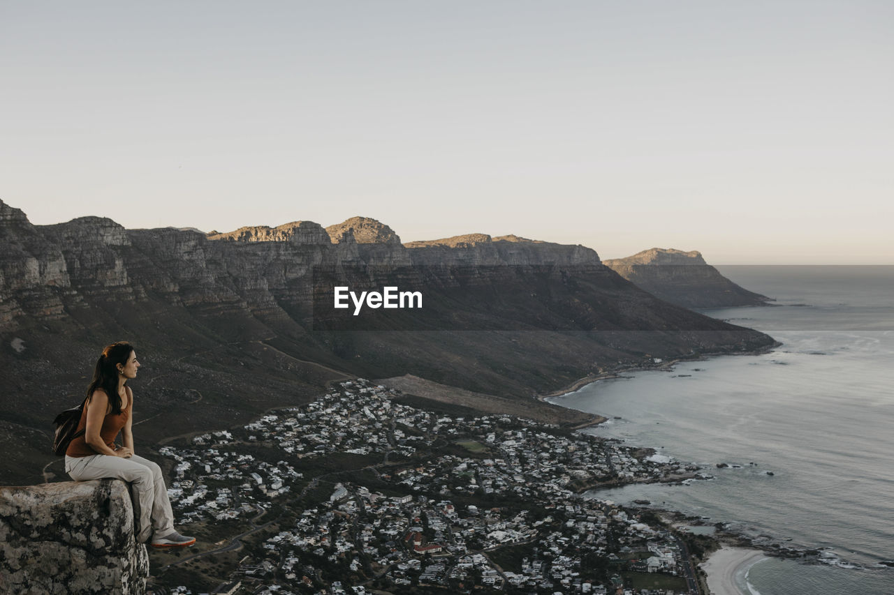 Woman looking at sea from lion's head mountain on weekend