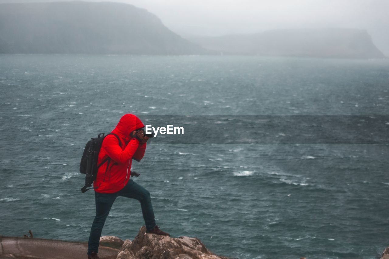 Man photographing sea