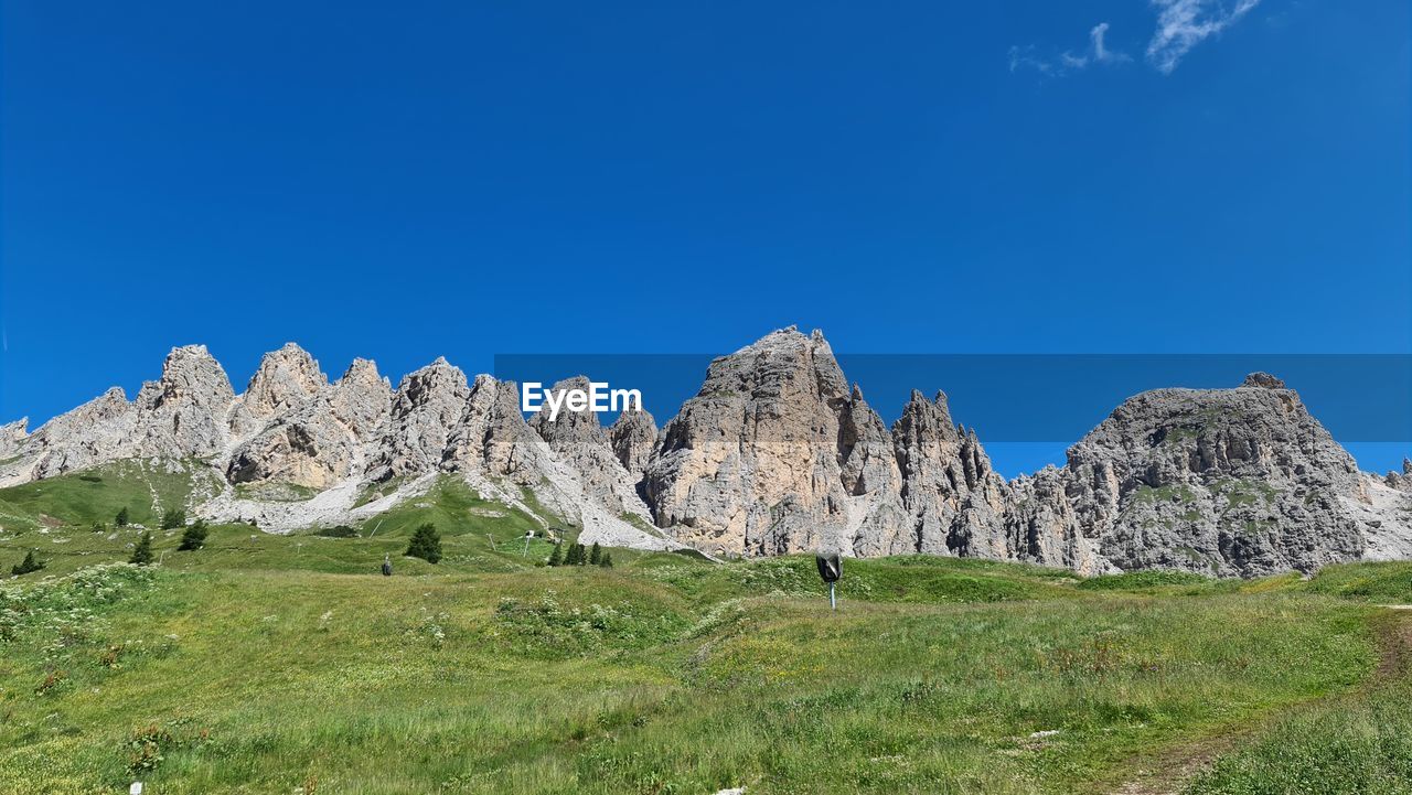 PANORAMIC VIEW OF LANDSCAPE AGAINST BLUE SKY