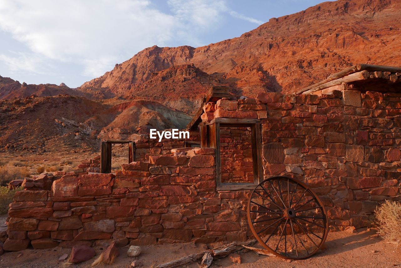 View of ancient brick wall with mountain in background