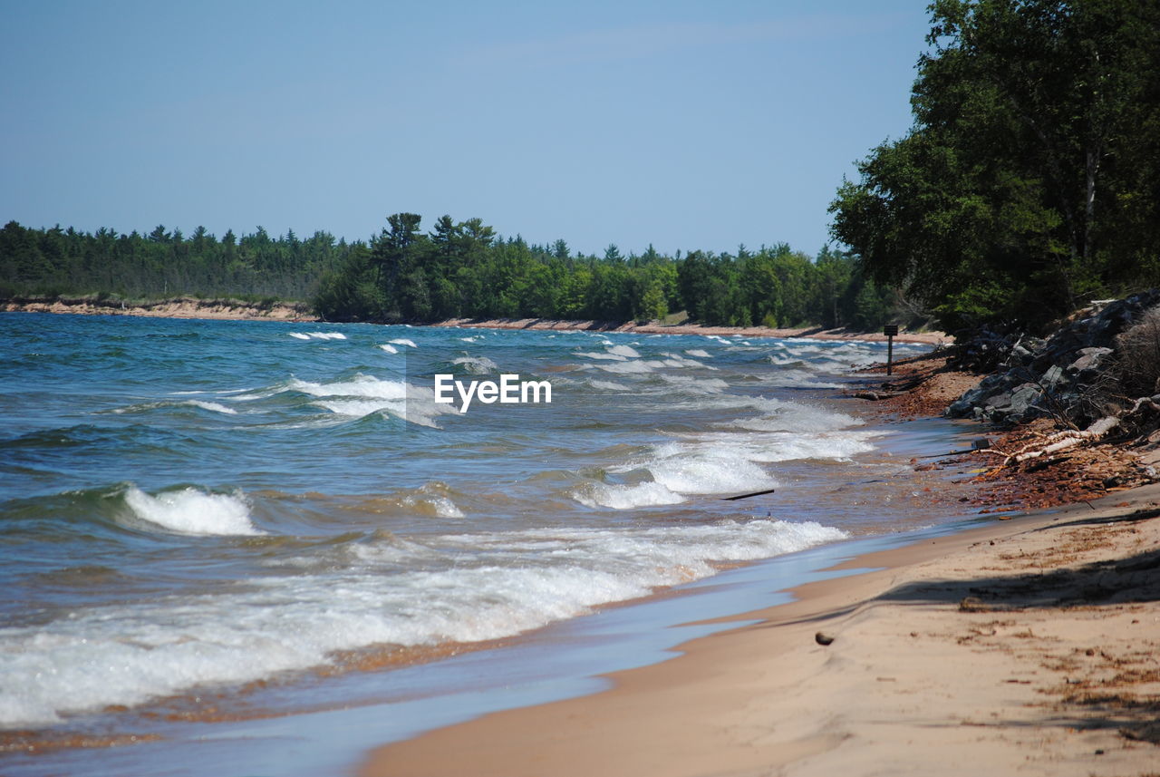 VIEW OF BEACH AGAINST CLEAR SKY