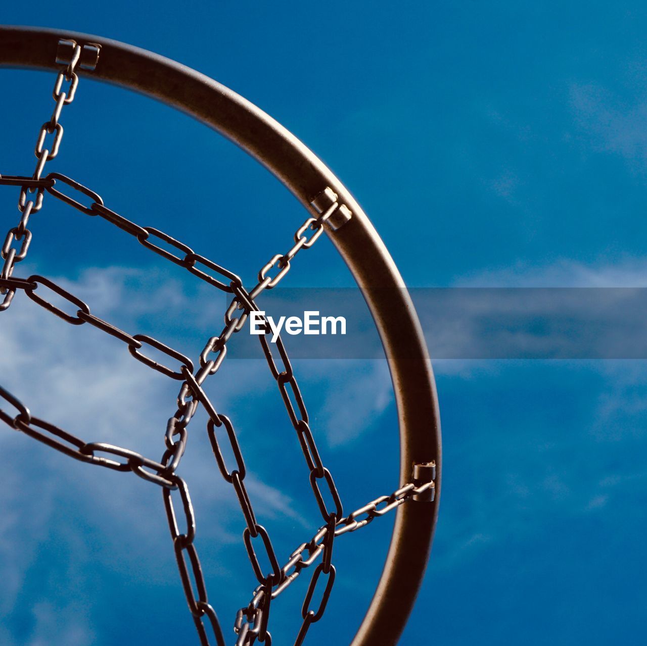 Basketball hoop and blue sky on the street