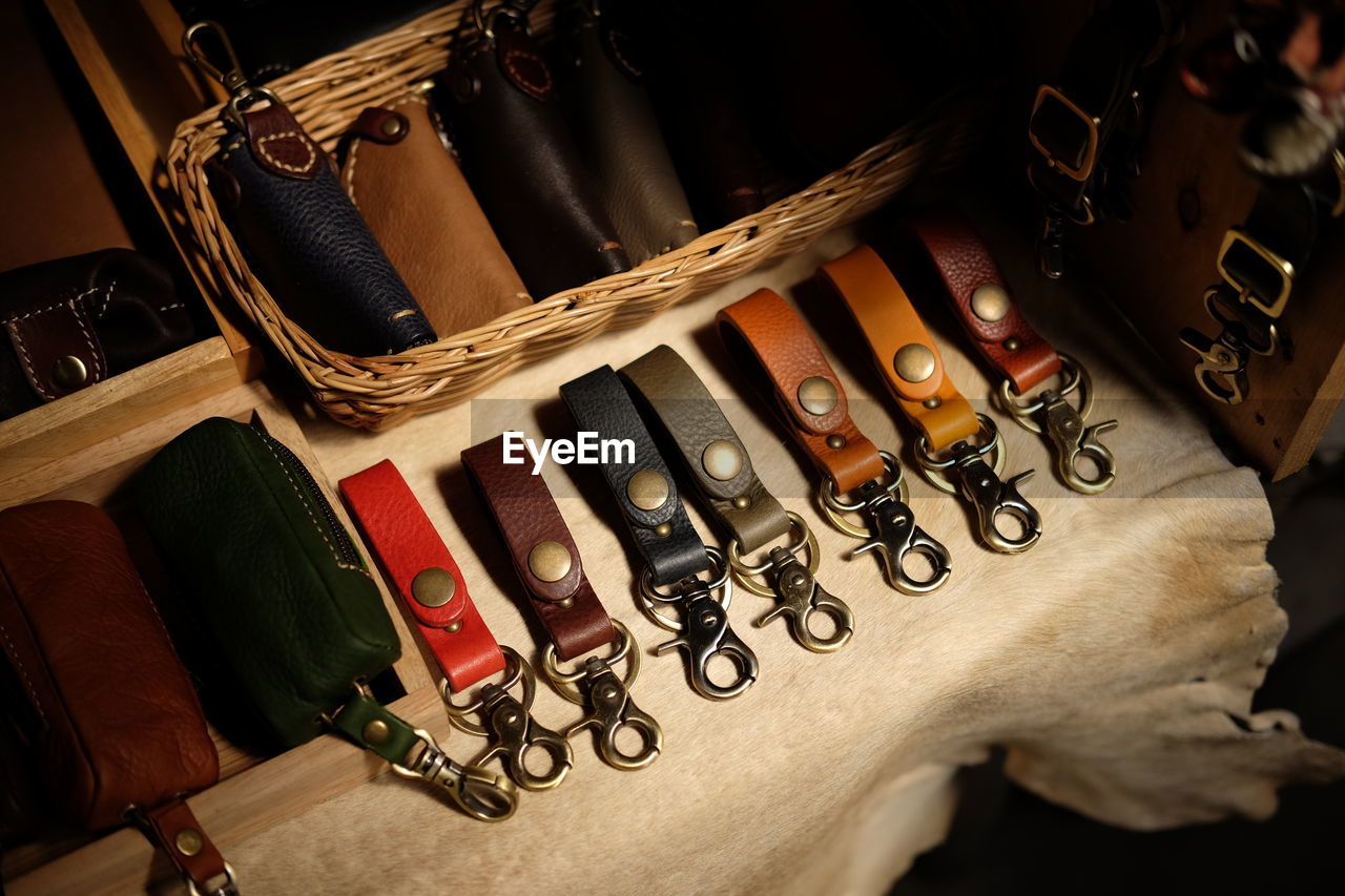 High angle view of leather objects for sale at market stall