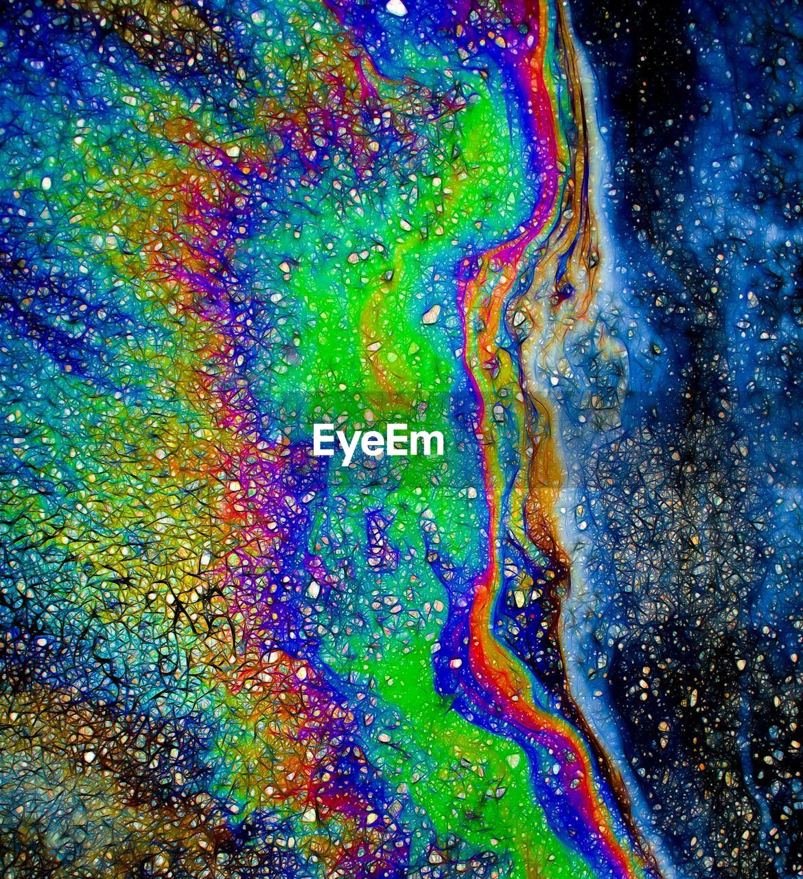 Full frame shot of multi colored oil spill