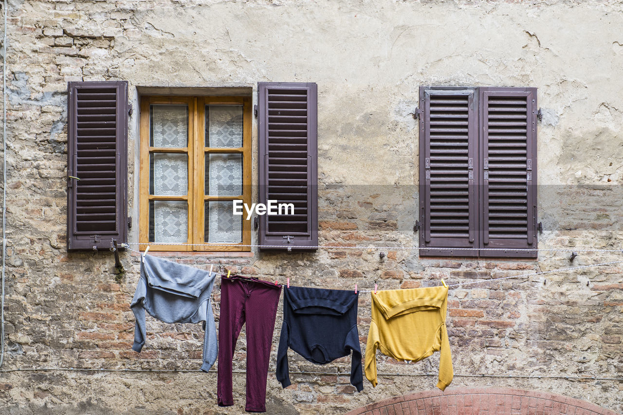 Laundry hanging outside to dry in florence / tuscany