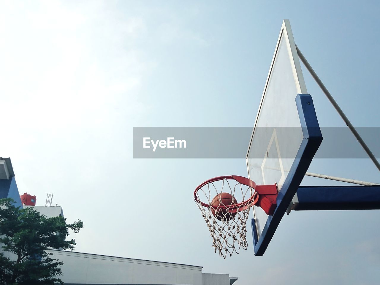 Low angle view of basketball hoop against sky