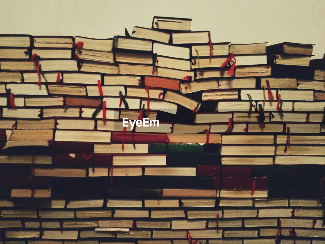 Books stacked against wall