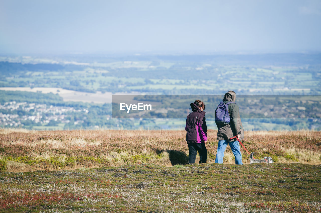 Rear view of two women on landscape