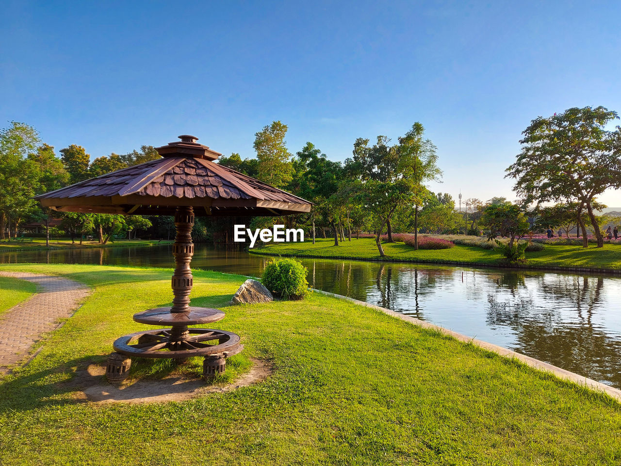 Gazebo in park against blue sky