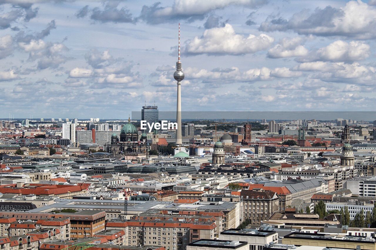 High angle view of cityscape against cloudy sky