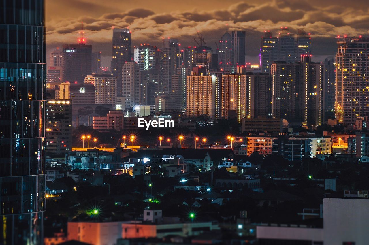 Aerial view of city lit up at night