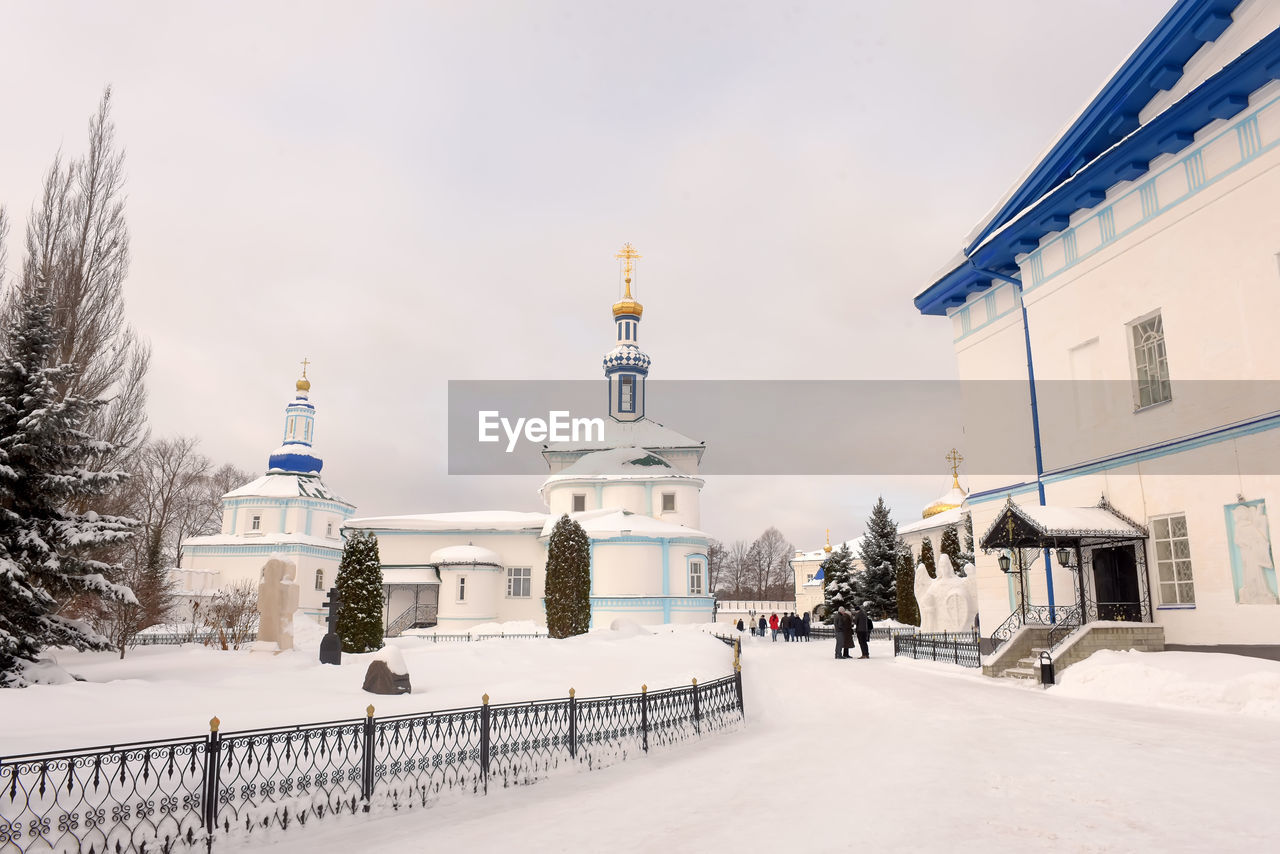 BUILDINGS AGAINST SKY DURING WINTER