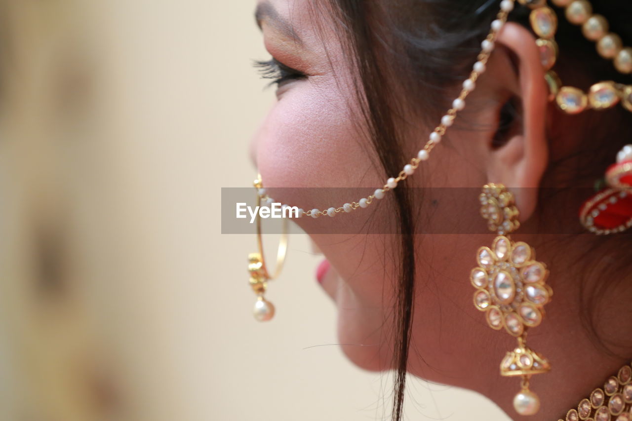 Close-up of bride wearing jewelry