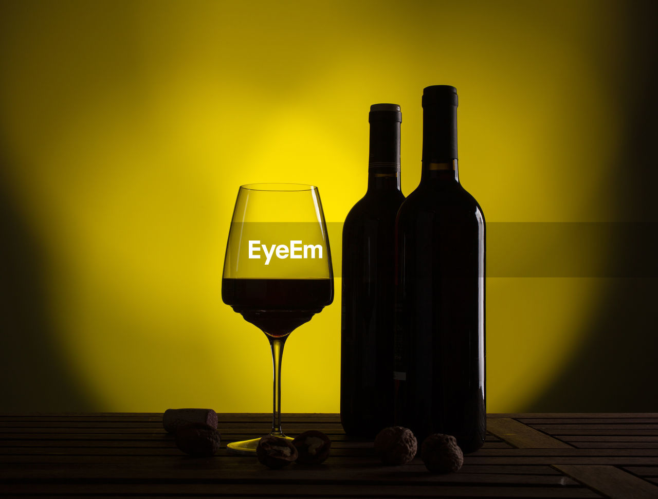 close-up of wineglass on table against sky during sunset